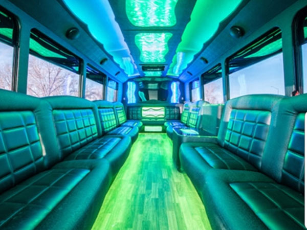 A bus with many seats and lights on the side.