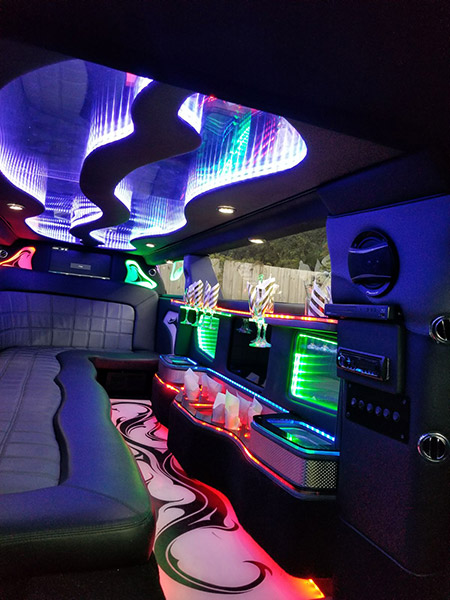 A limo with lights and tables in it