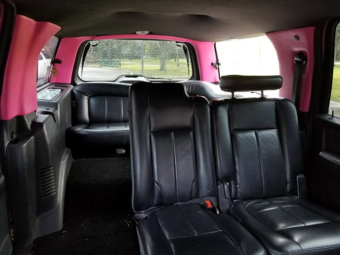 A car with pink seats in the back of it